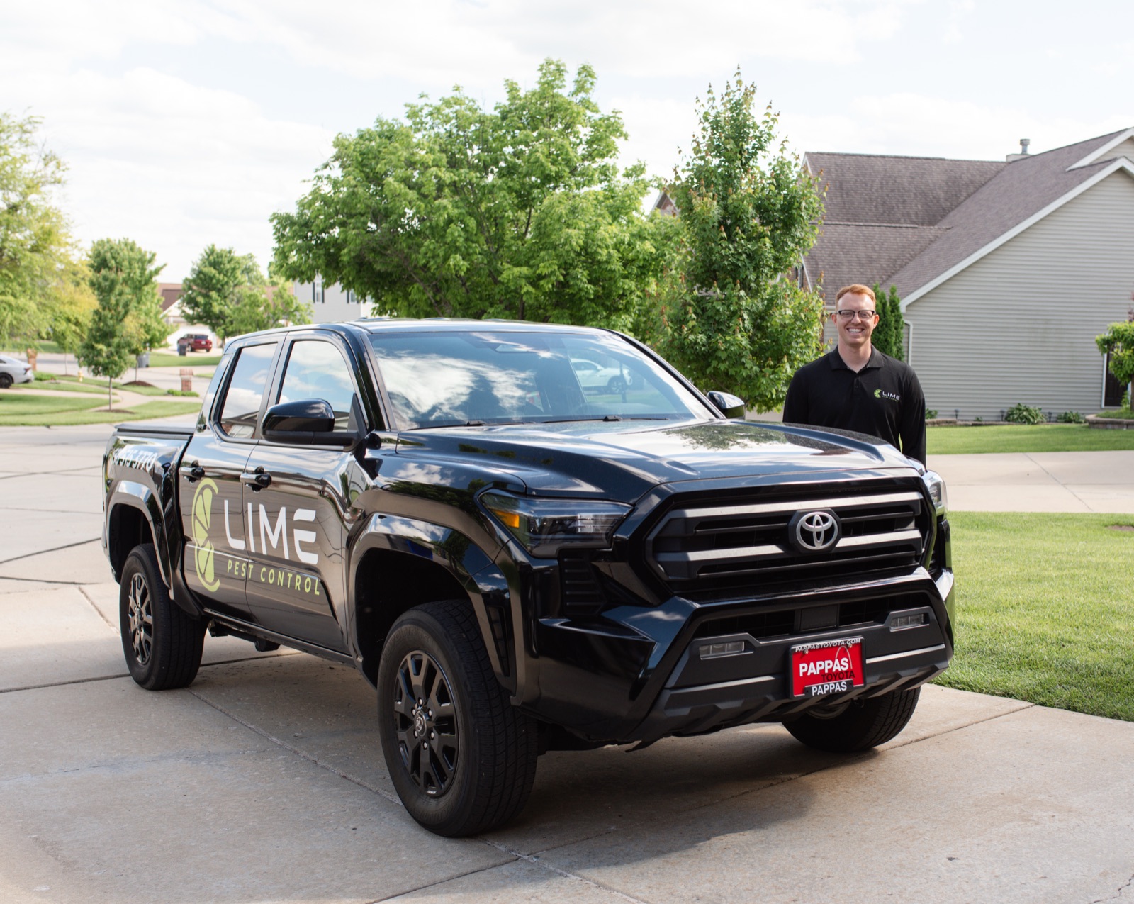 Lime Pest Control technician working outside a home